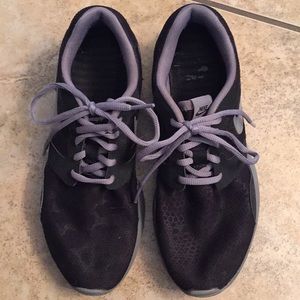 Black and grey animal print Nike tennis shoes